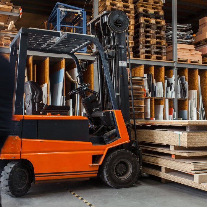 Inaithiram Diesel Operated Forklift in warehouse operation lifting log size wooden pallets